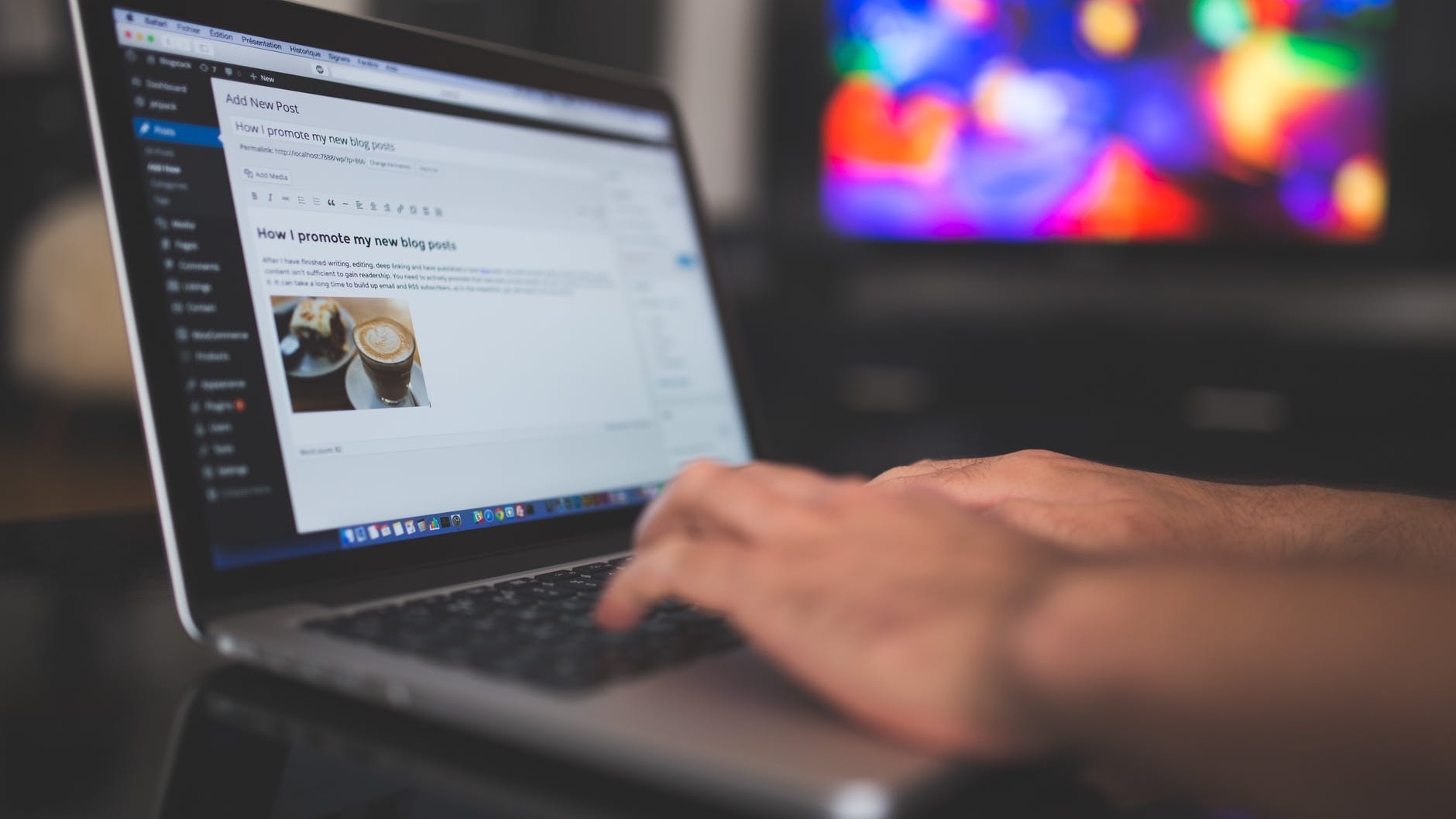 Photo of someone's hands typing on a laptop