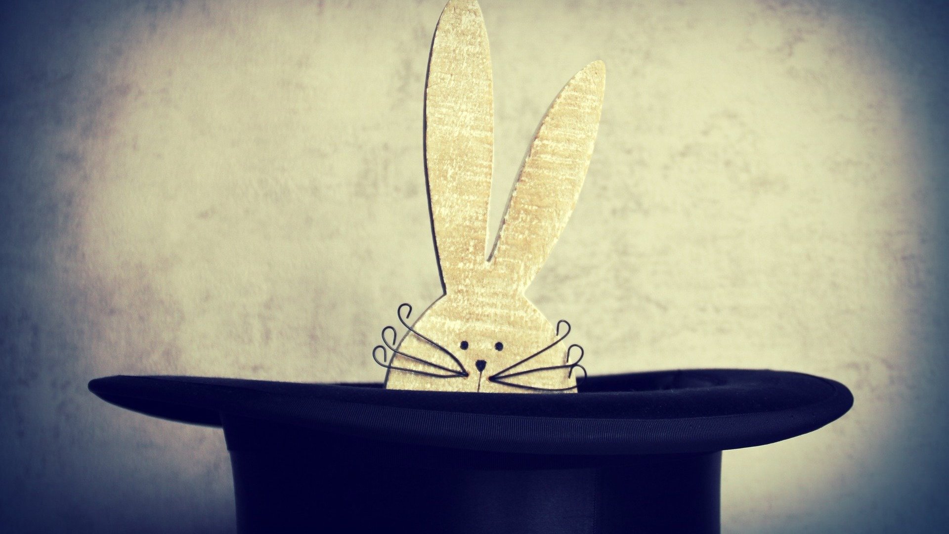 Stylised image of a rabbit emerging from a top hat